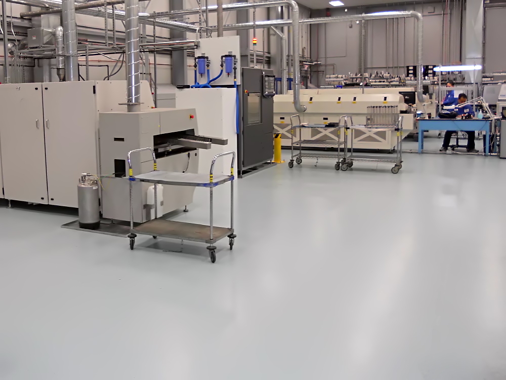 Electronics production floor with ESD-controlled polymer flooring