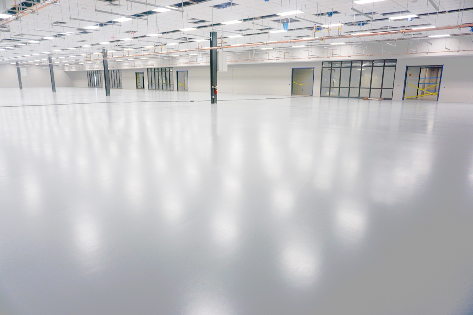 PIP-installed ESD polymer floor system in an electronics manufacturing facility (Wisconsin project)
